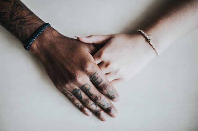 Supportive hands representing comfort during difficult times